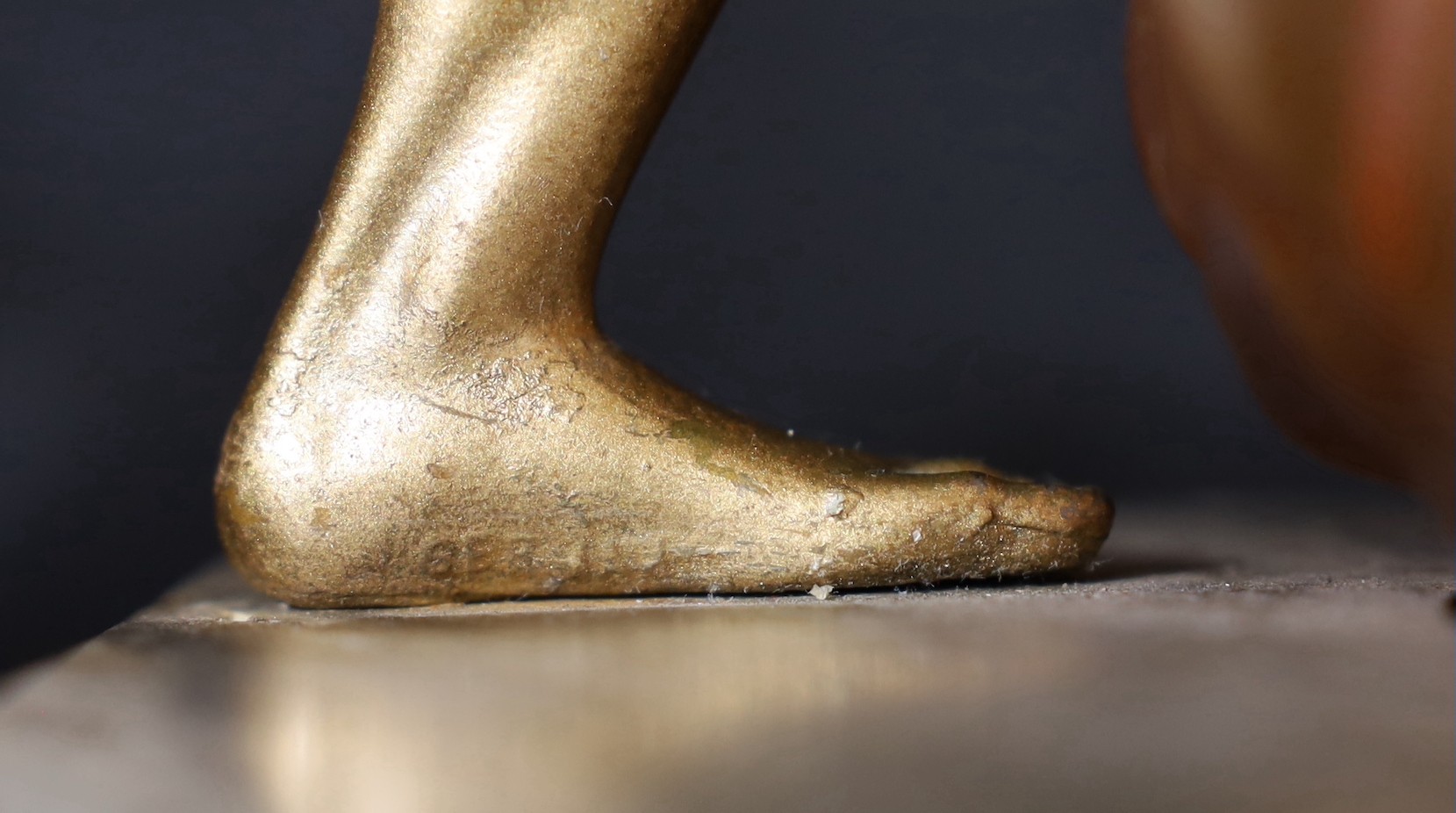 A 1930s Austrian bronzed spelter and marble lamp base modelled as Vulcan, stamped Bergman to the foot, height 32cm